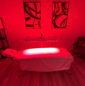 red light therapy panel and table in room